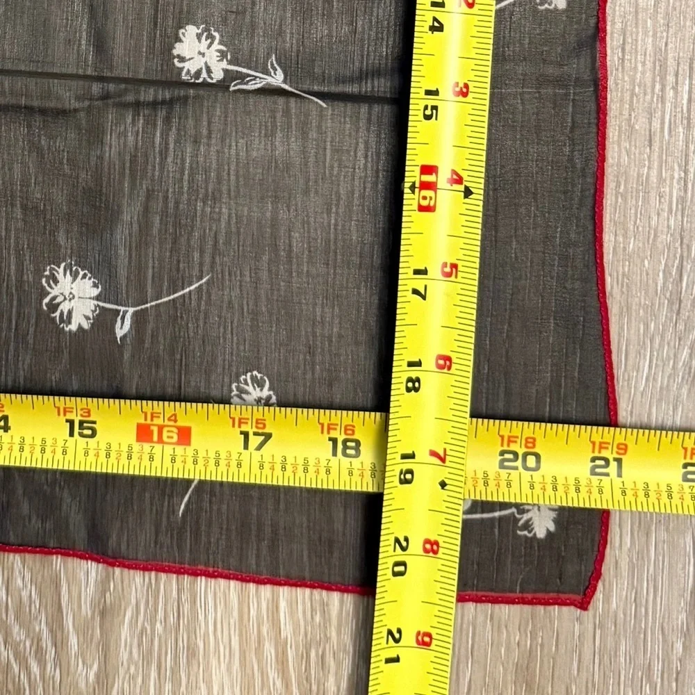 ECHO Small Black Sheer and stretch Scarf with white floral and red outline.